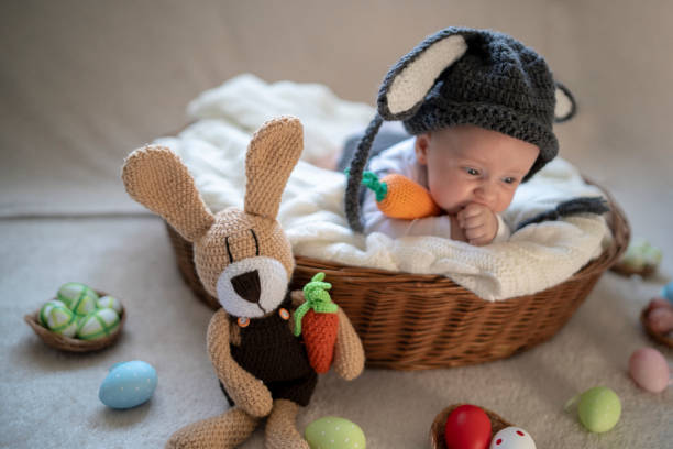 istock Cute baby bunny in the basket 1309525528