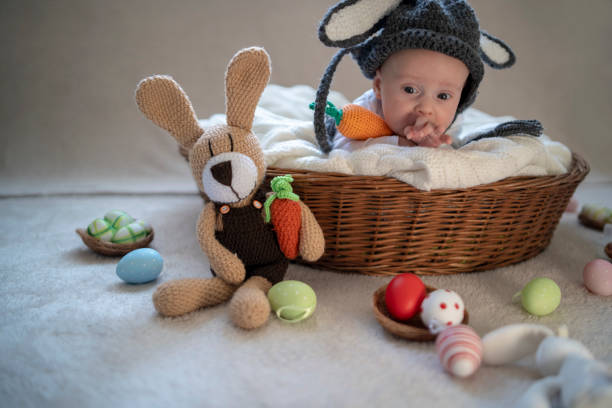 istock Cute baby bunny in the basket 1309525537