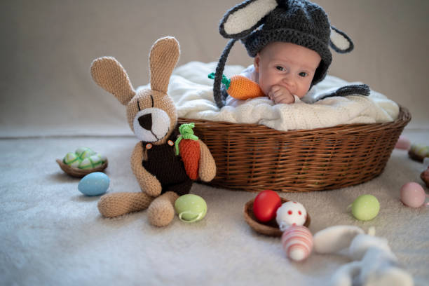 istock Cute baby bunny in the basket 1309525543