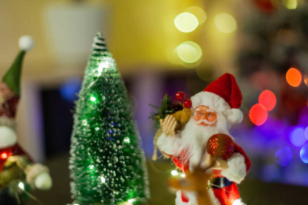 istock Santa Claus and Christmas tree, greeting card 1309528276