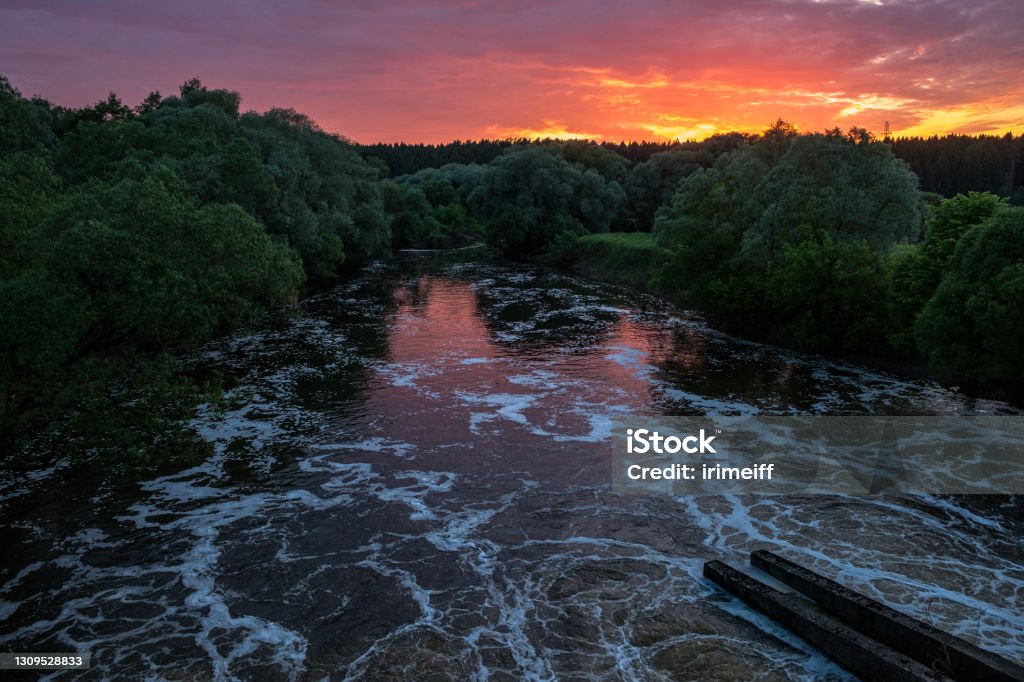 View from the dam in Obninsk on the Protva River at sunset View from the dam in Obninsk on the Protva River at sunset. Architecture Stock Photo