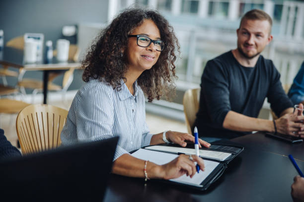 istock Female entrepreneur having meeting with team 1309529953