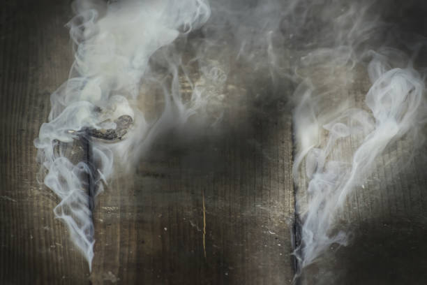 istock Smoke Finding Way Out From Burning House 1309531552