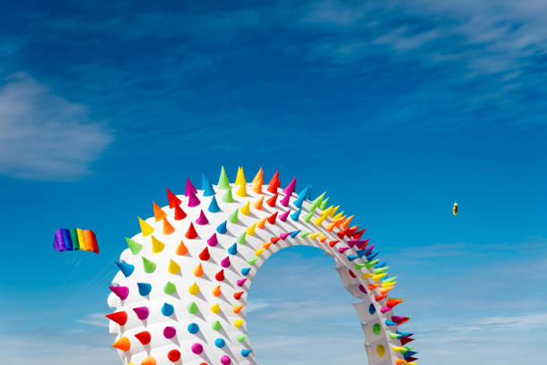 istock Colorful Kites flying over the sky 1309533248