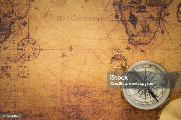 Old Compass On Vintage Map Stock Photo - Download Image Now - Map, Treasure Map, Navigational Compass