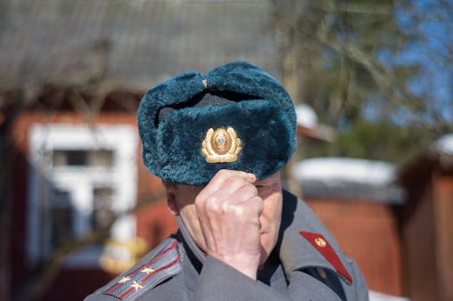 Outdoor portrait of a soviet colonel in winter uniform