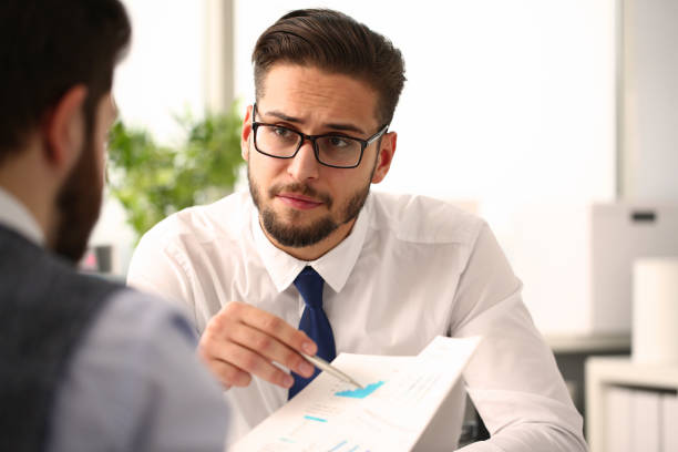 istock Two businessmen with financial graph in office 1309535863