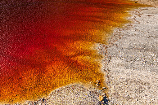 Laghetto delle Conche is a small lake of mineral origin with stunning shades of red and yellow