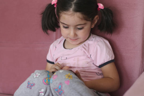 istock Little girl using the smartphone 1309536231