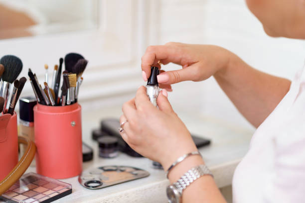 istock Make up artist hands working in her beauty visage studio salon with her brushes 1309539116