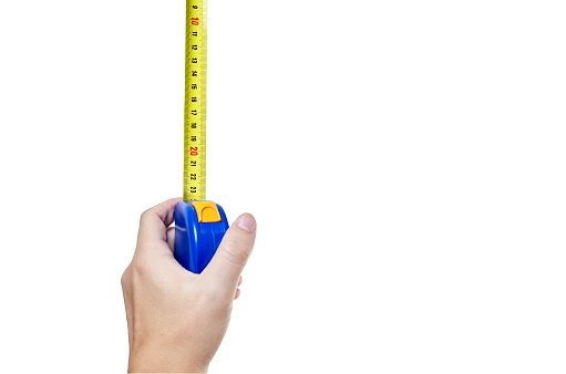 Human hand with tape measure isolated on white background with clipping path. Copy space, no shadows