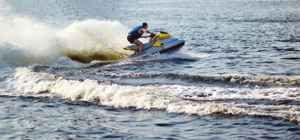 istock Man speeding on jet ski on lake during summer vacation 1309540095