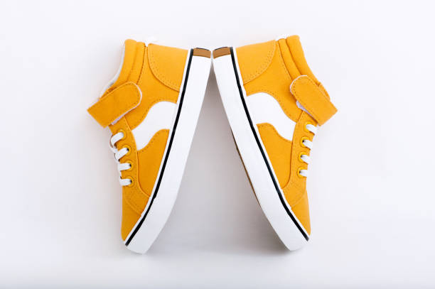 istock Orange baby sneakers isolated on white 1309542901