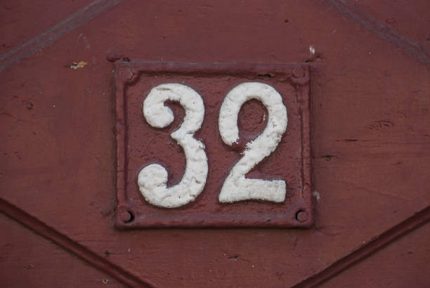 istock Old retro cast iron plate number 32 1309542956