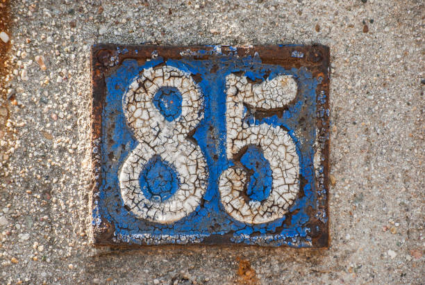 istock Old retro cast iron plate number 85 1309542979
