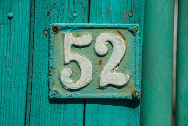 istock Old retro cast iron plate number 52 1309542982