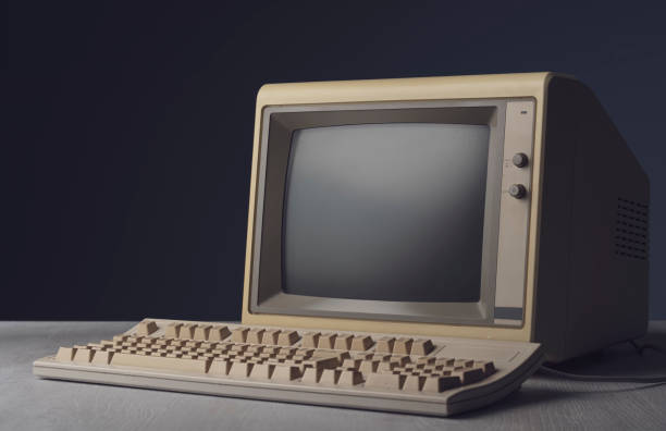 Vintage personal computer on a desktop Vintage personal computer with keyboard on a desktop, outdated electronics concept crt computer screen stock pictures, royalty-free photos & images