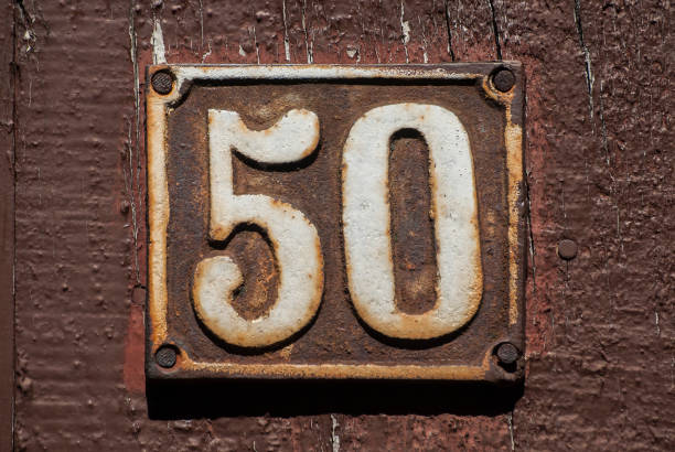 istock Old retro cast iron plate number 50 1309543040