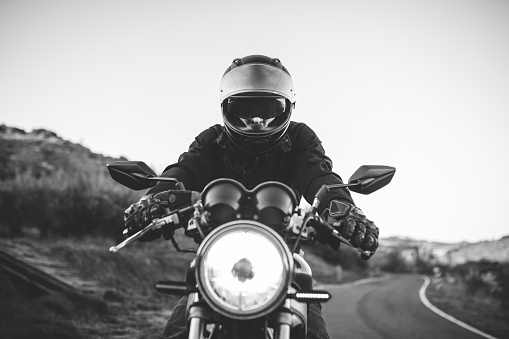 Riding the classic motorcycle through the countryside in Navarre, Spain.