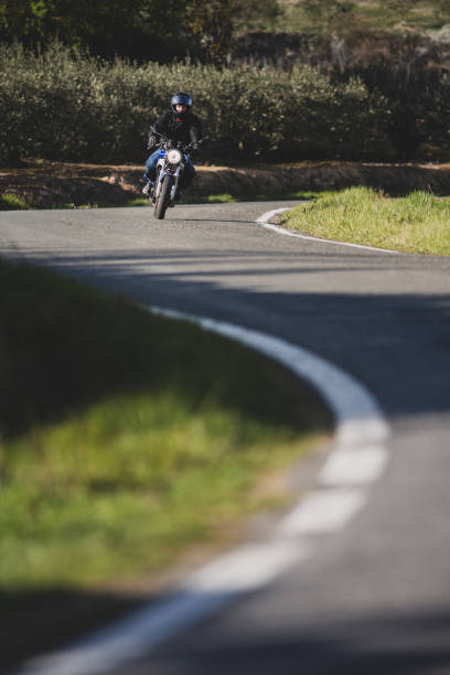 istock Riding the classic motorcycle through the countryside. 1309544316