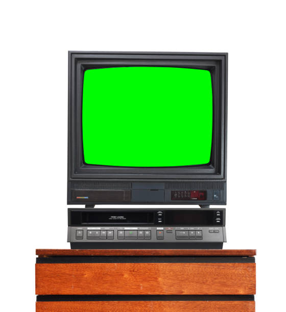 Old TV set with cut out green screen and VCR isolated on white, stand on vintage nightstand 1990s, 1980s. Old TV set with cut out green screen and VCR isolated on white, stand on vintage nightstand 1990s, 1980s. eject button stock pictures, royalty-free photos & images