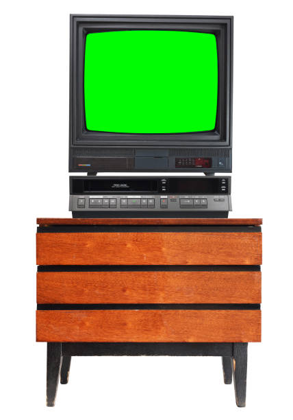 Old TV set with cut out green screen and VCR isolated on white, stand on vintage nightstand 1990s, 1980s. Old TV set with cut out green screen and VCR isolated on white, stand on vintage nightstand 1990s, 1980s. eject button stock pictures, royalty-free photos & images