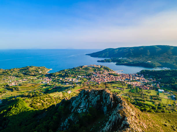 View from Monte Mar di Capanna (or Monte della Croce), the mountain that with its high iron cross dominates the coast and the town of Porto Azzurro
