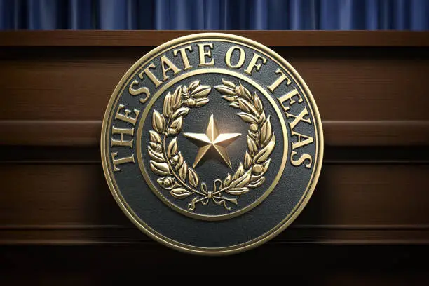 Photo of Symbol and big seal of State of Texas on the tribune. Press conference of governor of Texas or others political events of Texas concept.