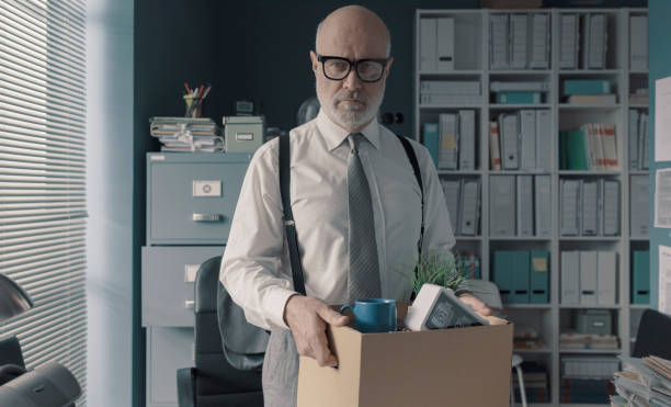istock Businessman packing and leaving the office 1309547533