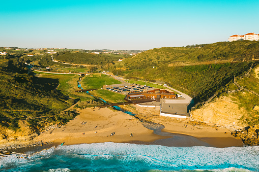 Aerial drone view of Praia de Ribeira d'Ilhas beach in Ericeira, Portugal. The Ericeira world surfing reserve 16.03.2021, Ericeira, Portugal. High quality photo