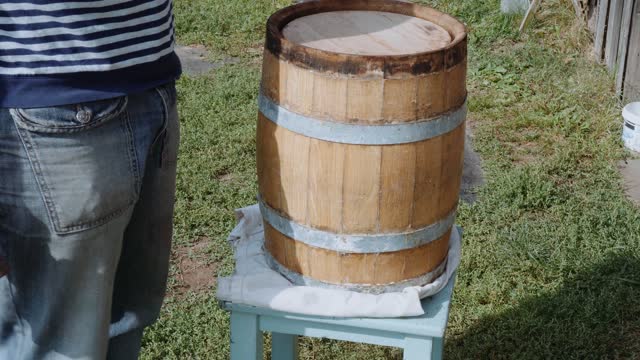 Oak Barrel. Opening the barrel with a chisel and hammer
