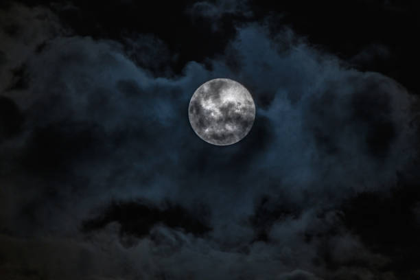 istock Full Moon, Supermoon, Worm Moon with Cloud Cover 1309554565
