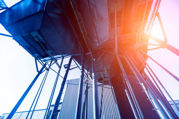 istock Industrial metallic construction at background with clear sky 1309555252