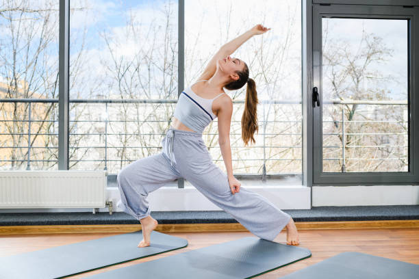 istock Girl dance and stretch in light studio 1309556304