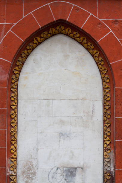 CU Ornate white stone facade over doorway of a building