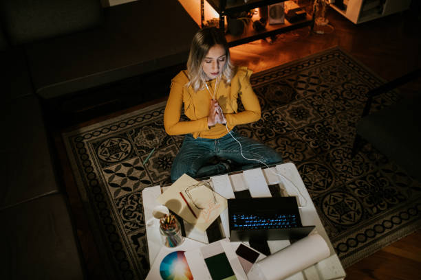 istock Woman taking a break from her work at home to meditate 1309560055