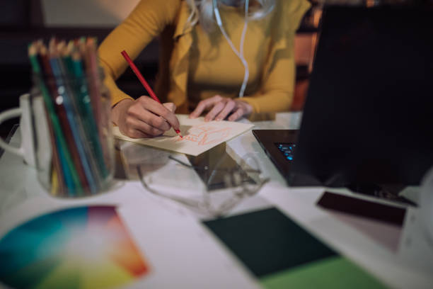 istock Young concentrated woman working at night time using laptop computer 1309560186