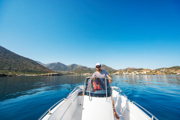 istock Father and son yachting 1309560530