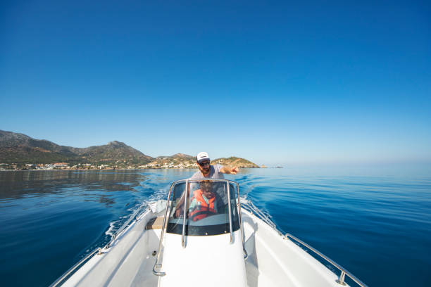 istock Father and son yachting 1309560577