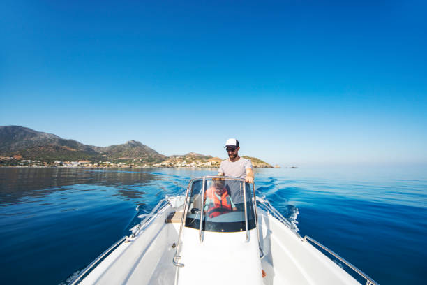 istock Father and son yachting 1309560586