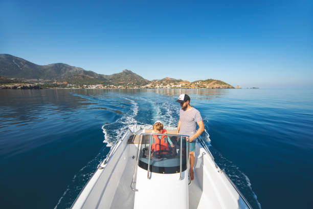 istock Father and son yachting 1309560608