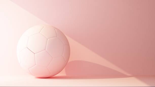 istock soccer ball lit by a ray of light colored pink 1309562055