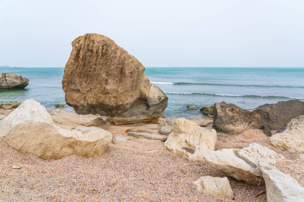 istock Rocky sea beach with boulders 1309564184
