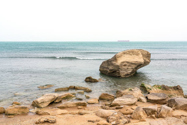 istock Rocky sea beach with boulders 1309564229