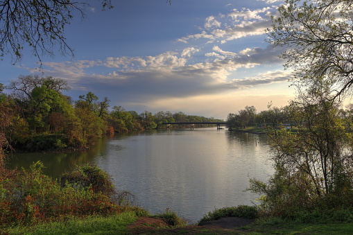 The sun rises on the Brazos River in Waco Texas