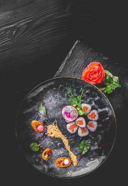 istock sushi roll in plate on wooden table background 1309565604