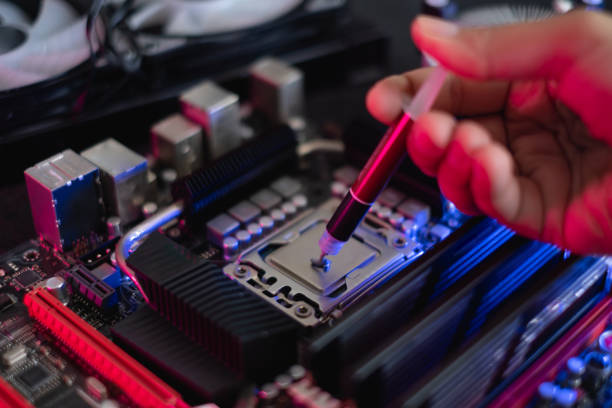 istock computer parts with CPU, graphics card, liquid cooling and motherboard 1309566425