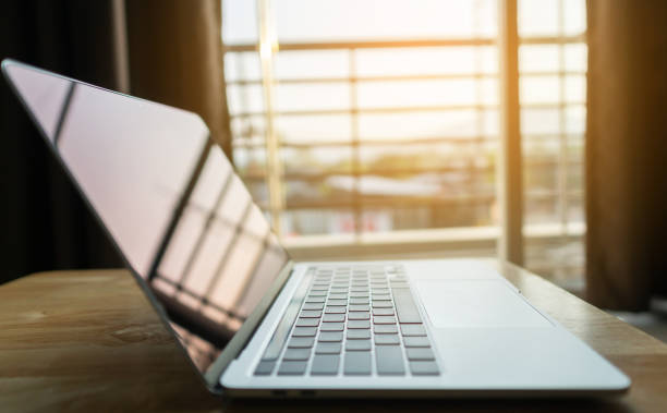 istock Close up modern laptop on wood table 1309566945
