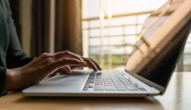 istock Closeup woman working on modern laptop 1309567562