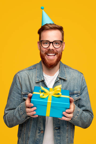 istock Happy bearded man celebrating birthday 1309569227